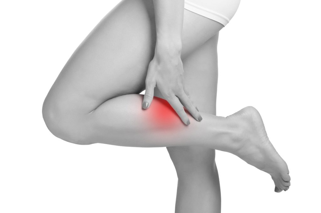 a woman with lower leg pain