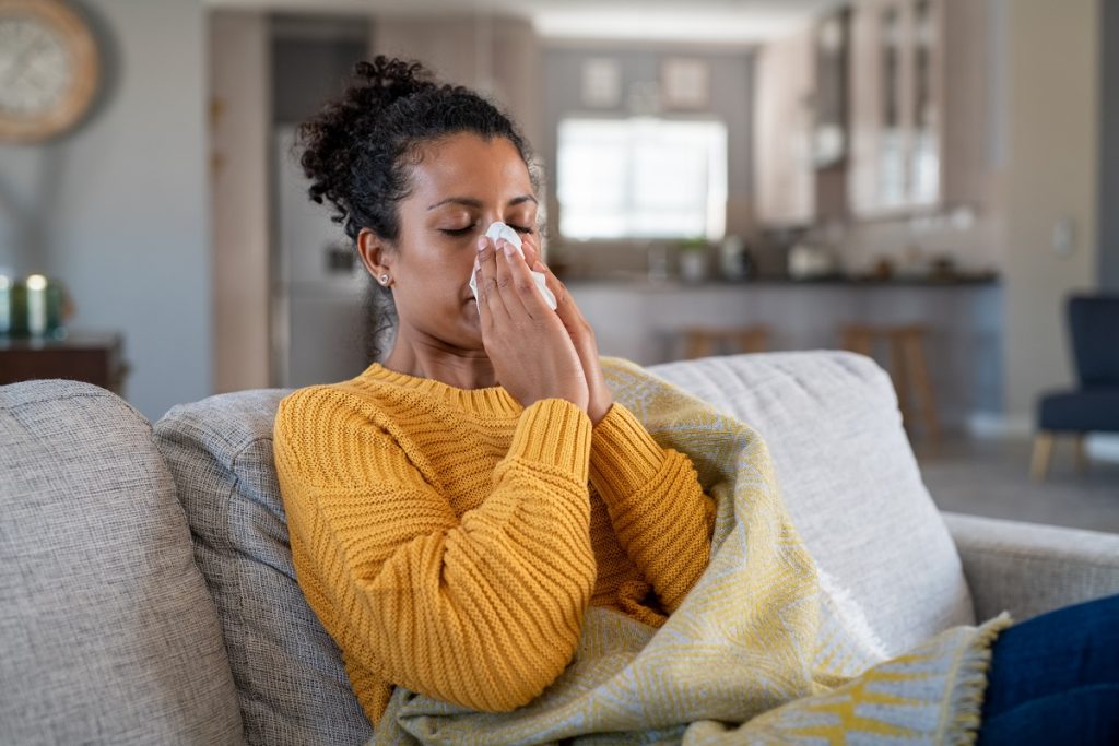 woman with allergies at home